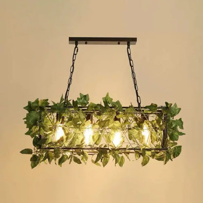 Rustic industrial cage island light with pink flowers dining room