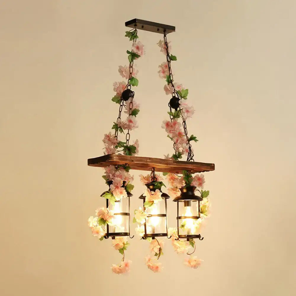 Rustic industrial cage island light with pink flowers dining room