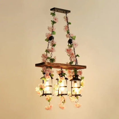 Rustic industrial cage island light with pink flowers dining room