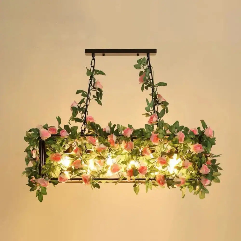 Rustic industrial cage island light with pink flowers dining room