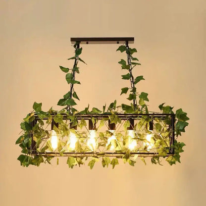 Rustic industrial cage island light with pink flowers dining room