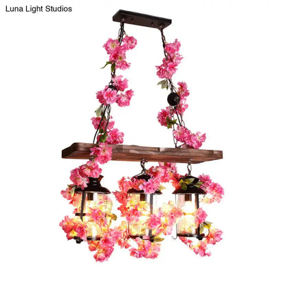 Industrial wood and clear glass restaurant island light with plants