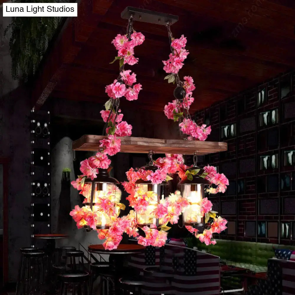 Industrial wood and clear glass restaurant island light with plants