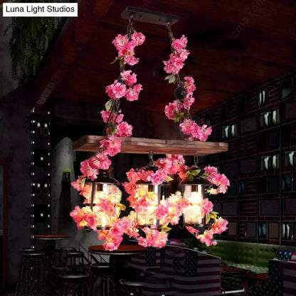 Industrial wood and clear glass restaurant island light with plants