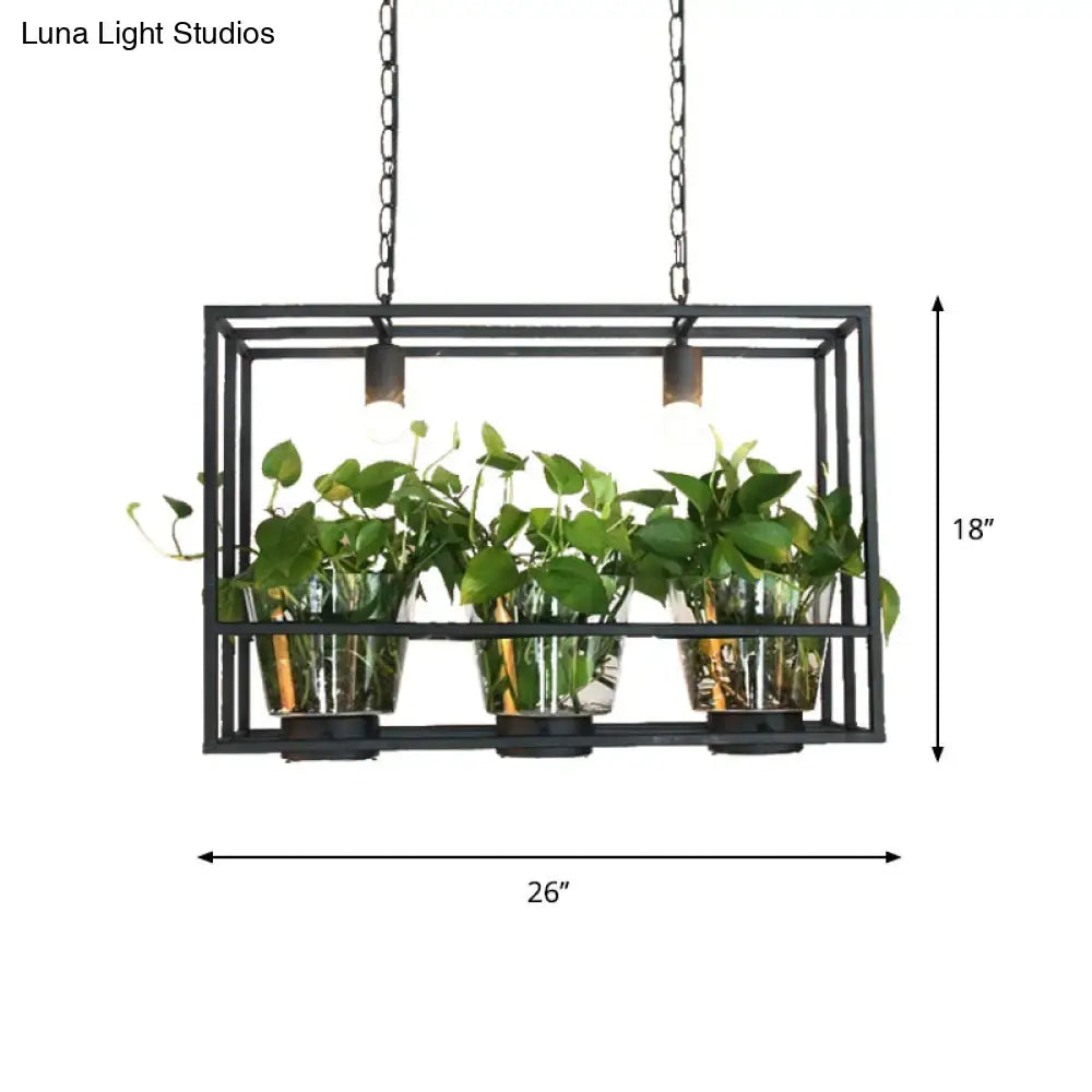 Industrial black iron island light with glass plant pot dining room