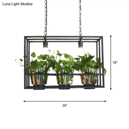 Industrial black iron island light with glass plant pot dining room