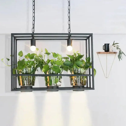 Industrial black iron island light with glass plant pot dining room