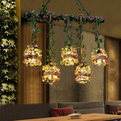 Industrial black cage island lighting fixture with flowers dining room