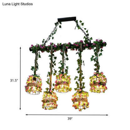 Industrial black cage island lighting fixture with flowers dining room