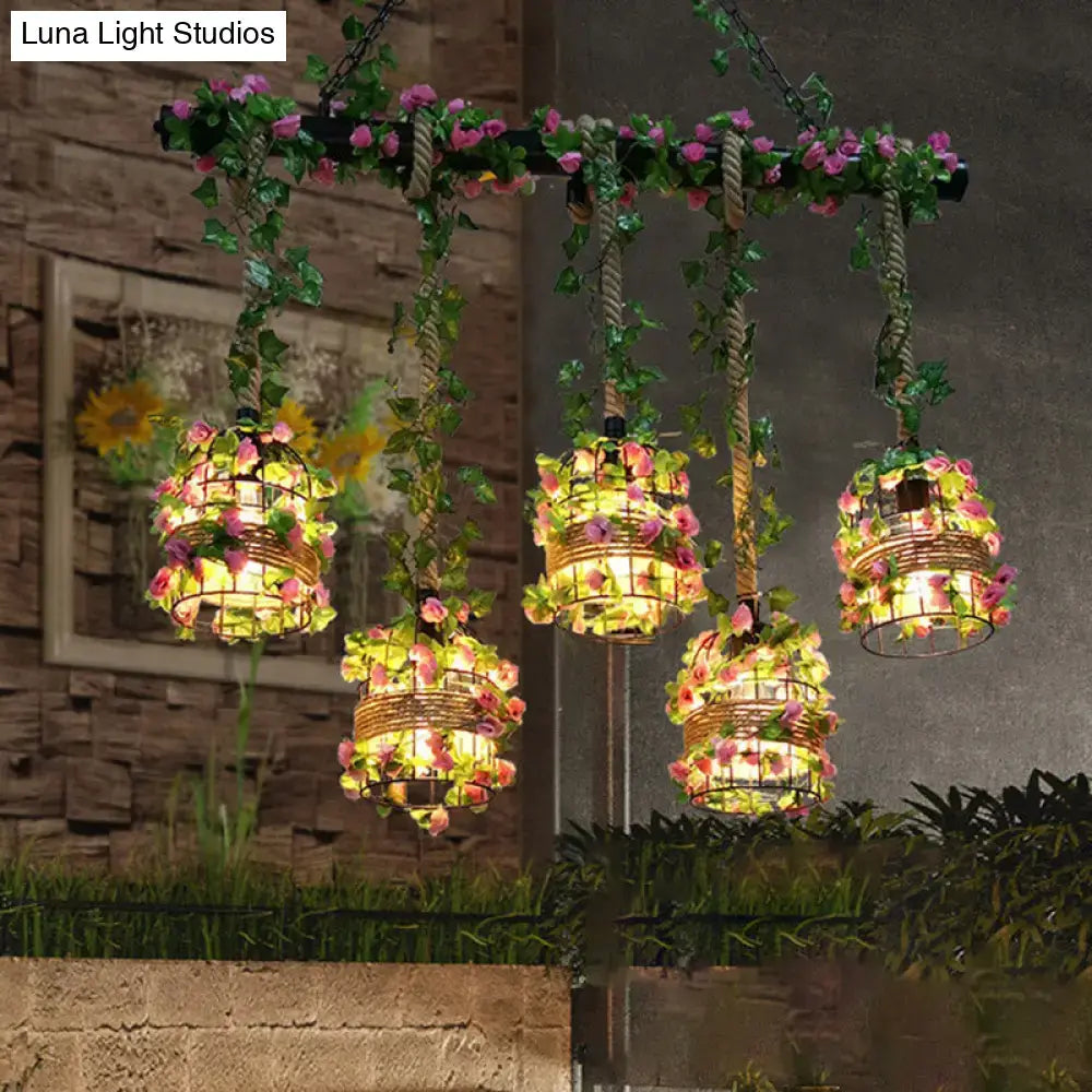 Industrial black cage island lighting fixture with flowers dining room