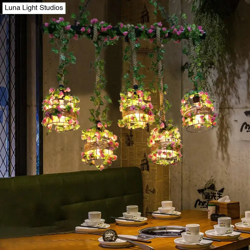 Industrial black cage island lighting fixture with flowers dining room
