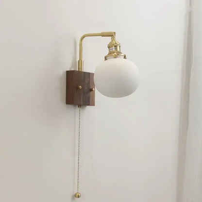 Brass and wood globe wall sconce bedroom light fixture