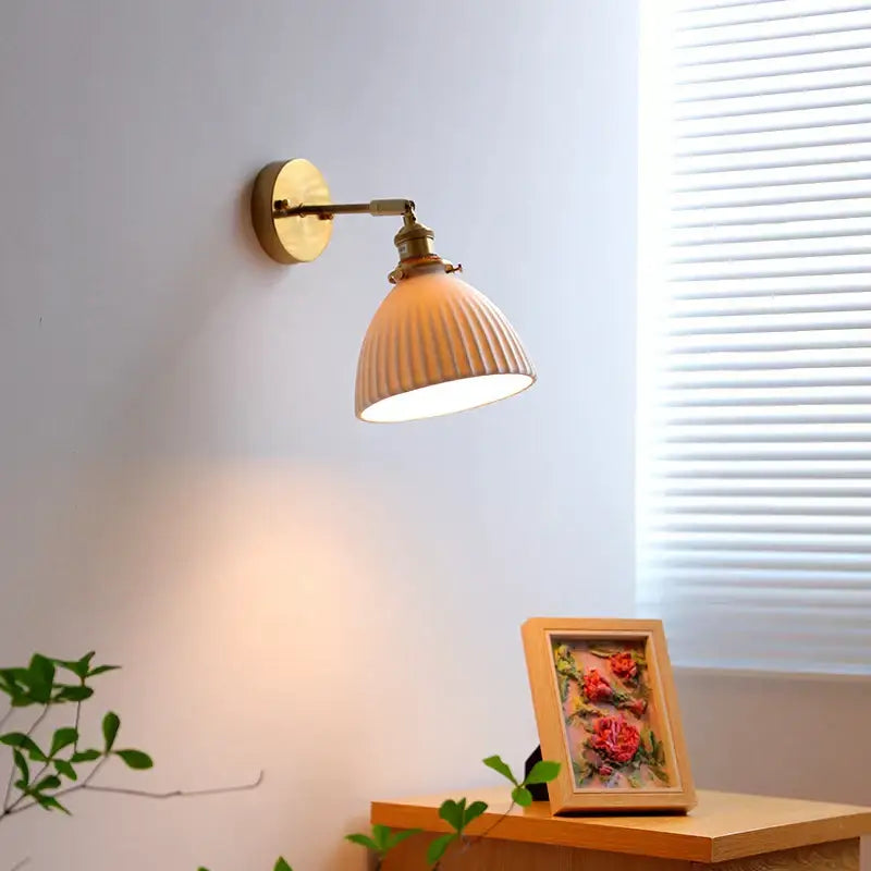 Ribbed white glass and brass ceramic wall sconce for bedroom lighting