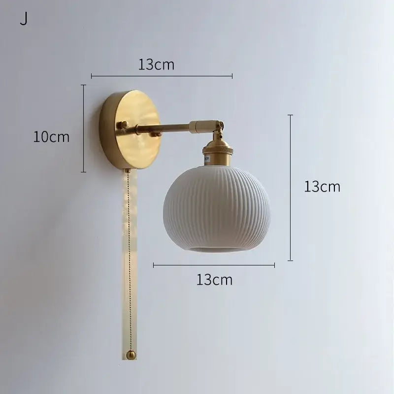 Ribbed white glass and brass ceramic wall sconce for bedroom lighting