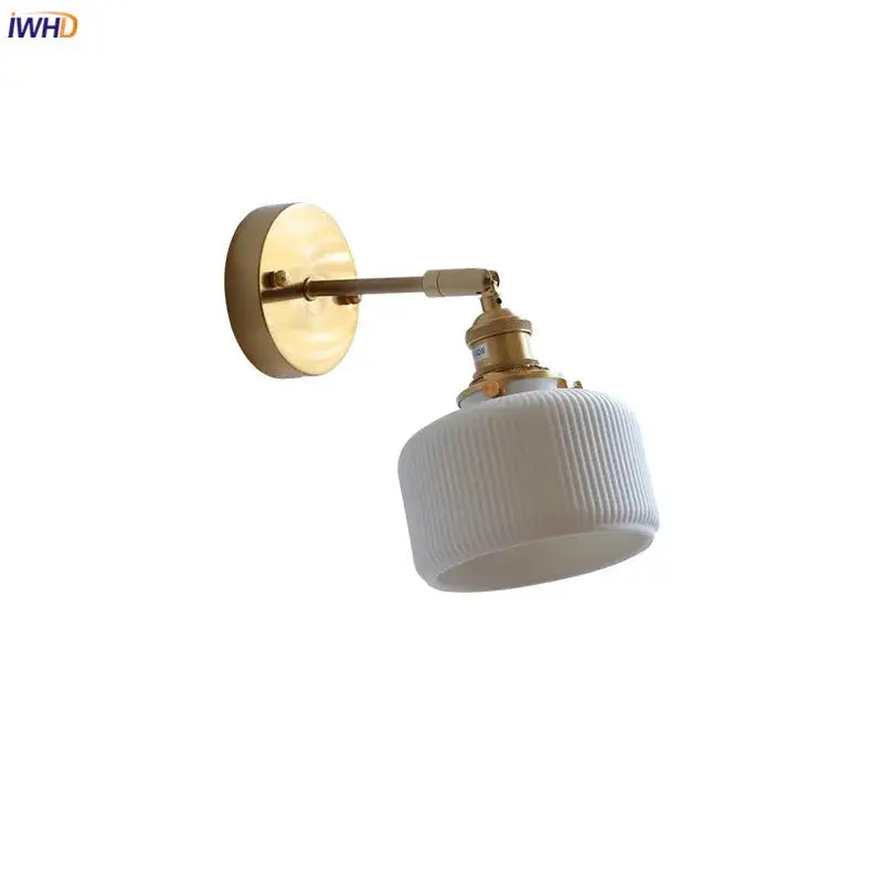 Ribbed white glass and brass ceramic wall sconce for bedroom lighting