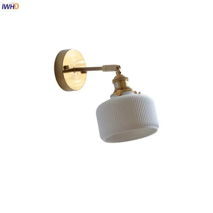 Ribbed white glass and brass ceramic wall sconce for bedroom lighting