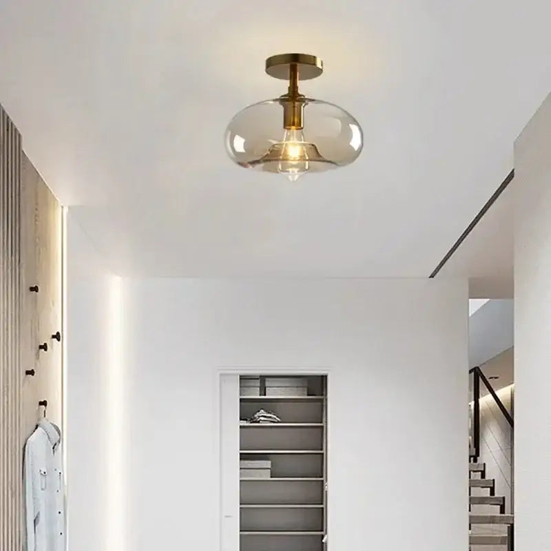 Modern brass and amber glass ceiling light for living room
