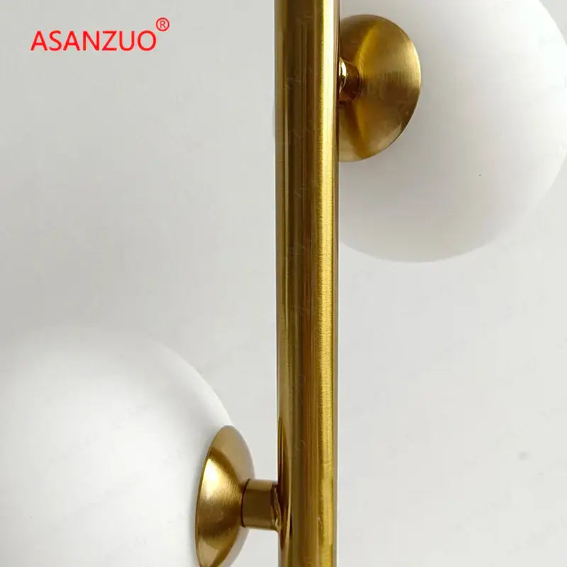 Modern gold 3 globe table lamp with milk white glass for bedroom