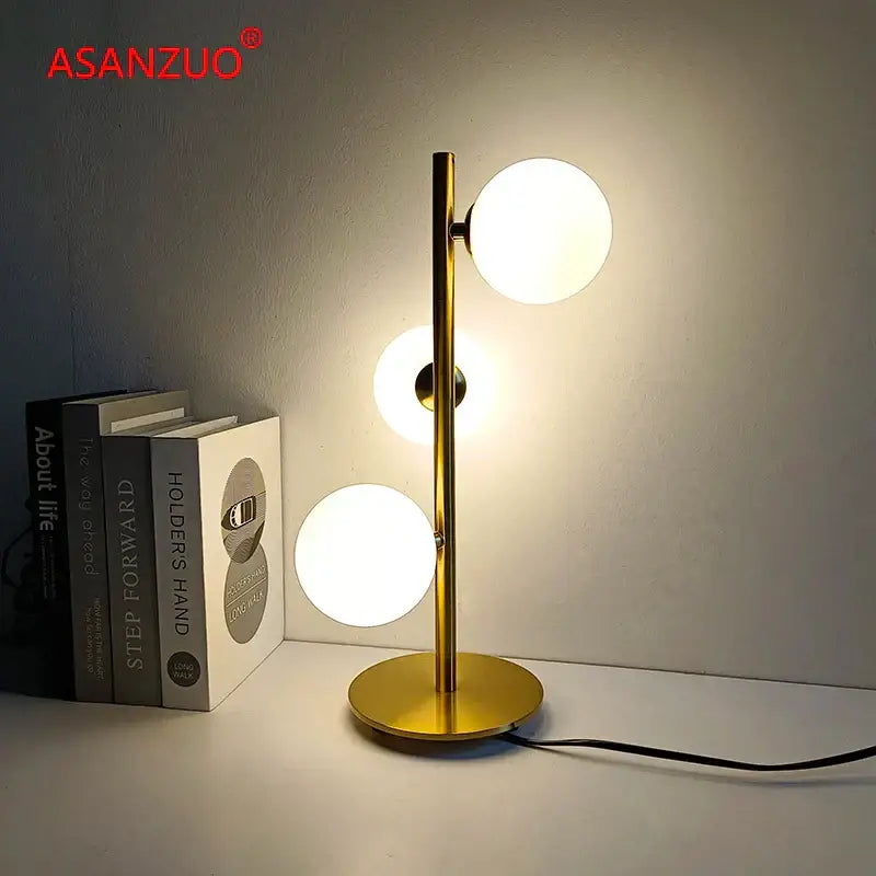 Modern gold 3 globe table lamp with milk white glass for bedroom