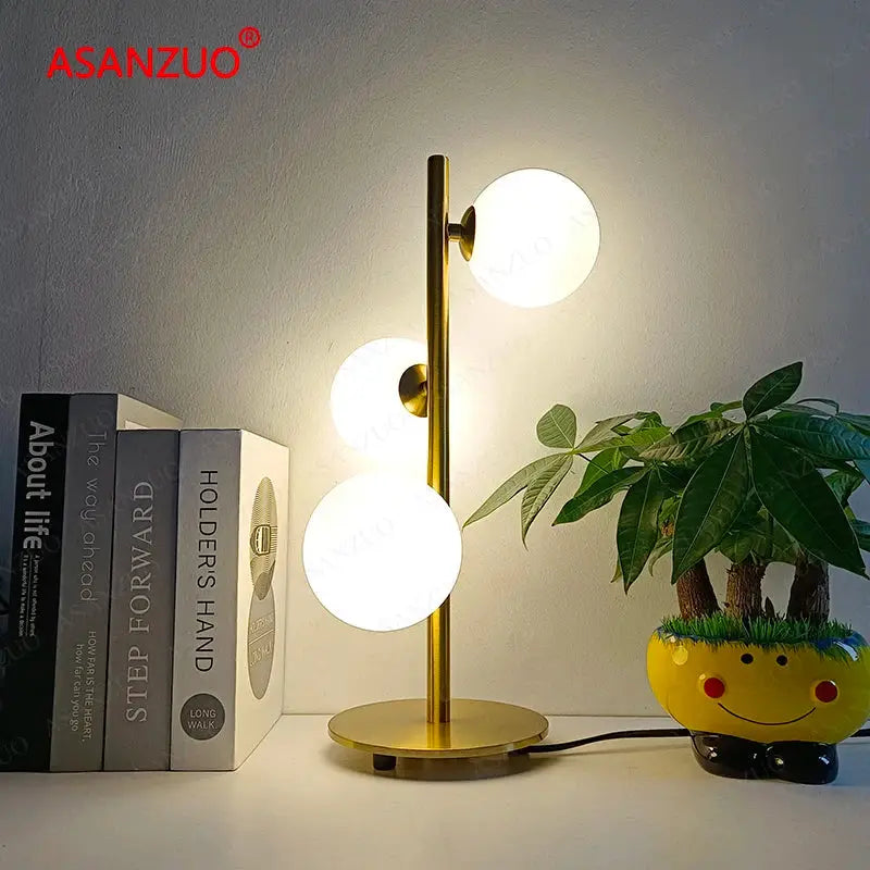 Modern gold 3 globe table lamp with milk white glass for bedroom