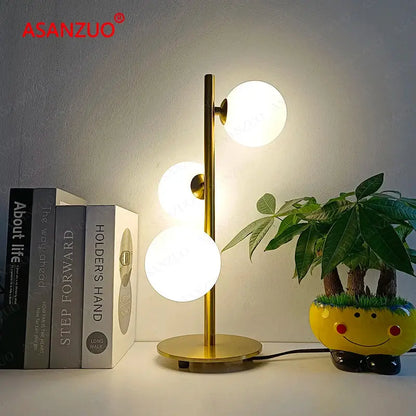 Modern gold 3 globe table lamp with milk white glass for bedroom