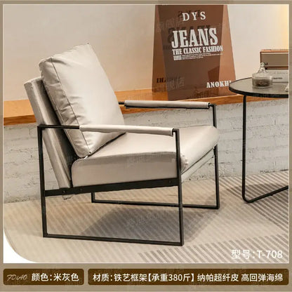Modern brown leather lounge chair reception area black metal frame