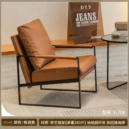 Brown leather single sofa chair with black metal frame for reception