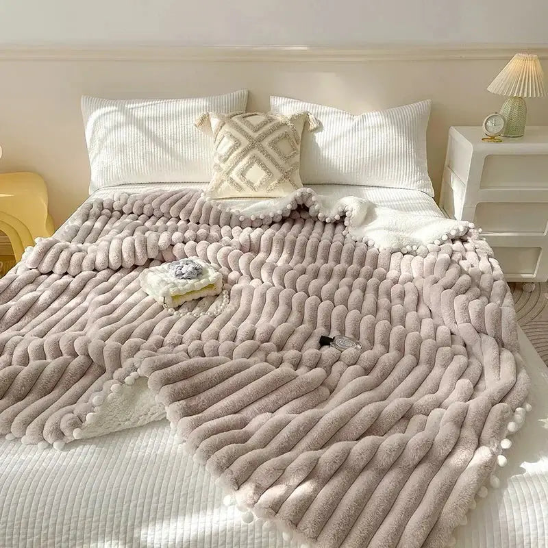 Pink faux rabbit fur chunky knit blanket with pom poms bedroom throw