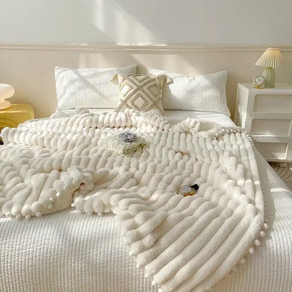 Pink faux rabbit fur chunky knit blanket with pom poms bedroom throw