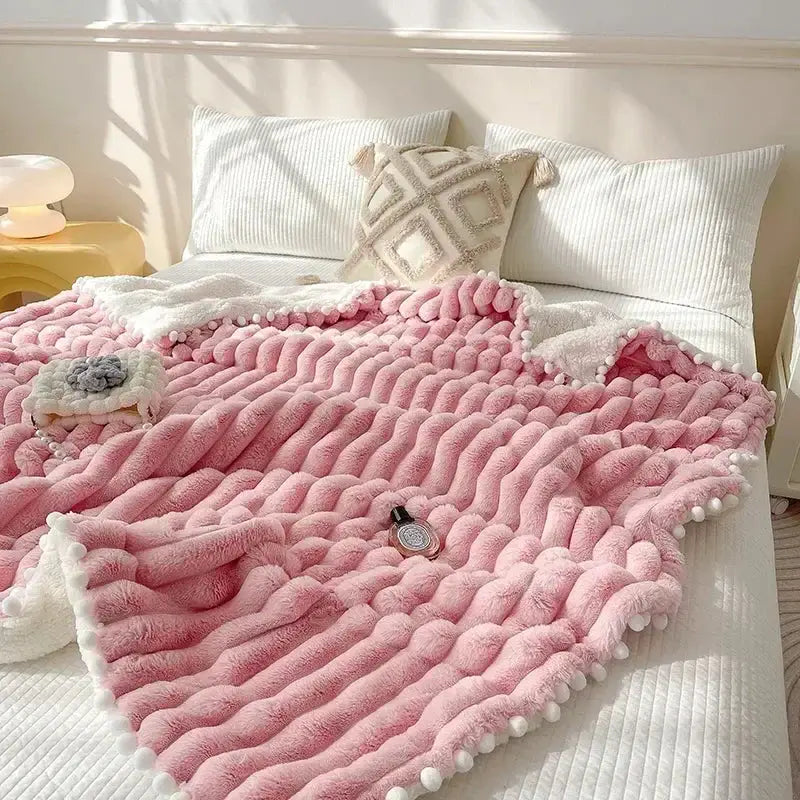 Pink faux rabbit fur chunky knit blanket with pom poms bedroom throw