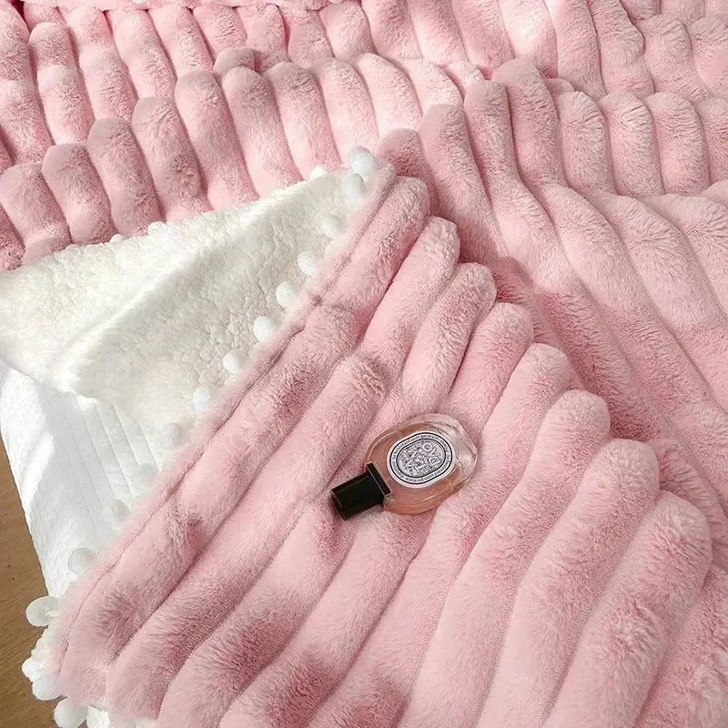 Pink faux rabbit fur chunky knit blanket with pom poms bedroom throw