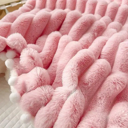 Pink faux rabbit fur chunky knit blanket with pom poms bedroom throw