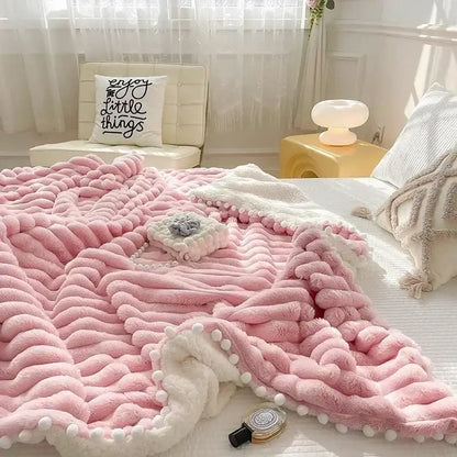 Pink faux rabbit fur chunky knit blanket with pom poms bedroom throw