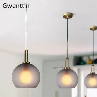 Luxe glass ball pendant lights brass and frosted glass dining room