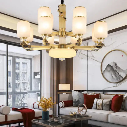 Luxe jade brass chandelier with frosted glass for living room