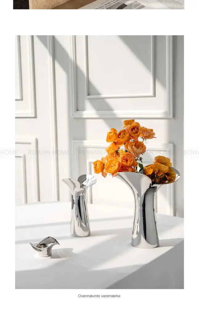 Modern sculptural silver stainless steel vase living room decor