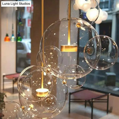 Modern brass bubble cluster pendant light – dining room clear glass