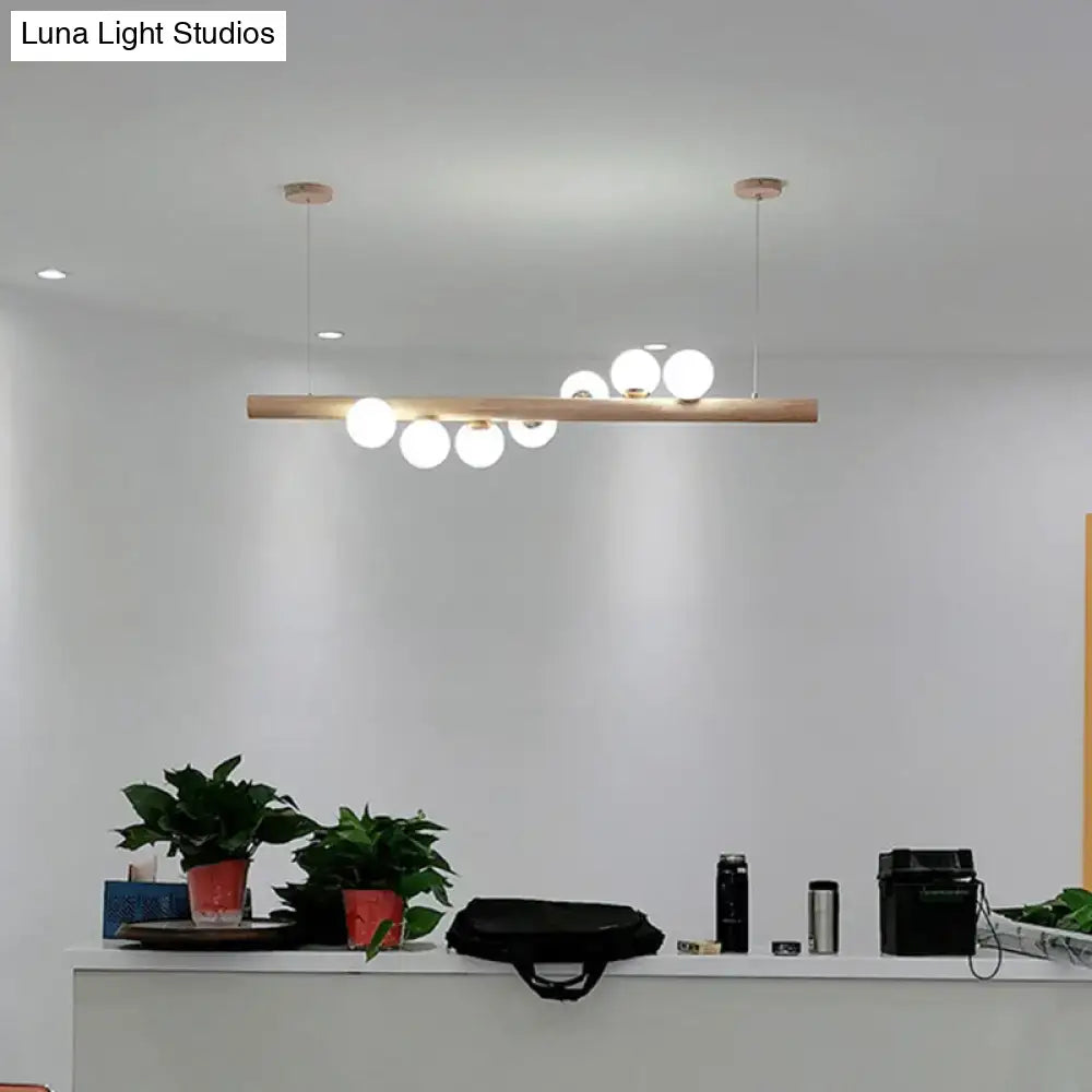 Modern cream and wood ball island pendant light dining room