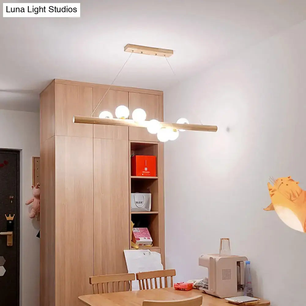 Modern cream and wood ball island pendant light dining room