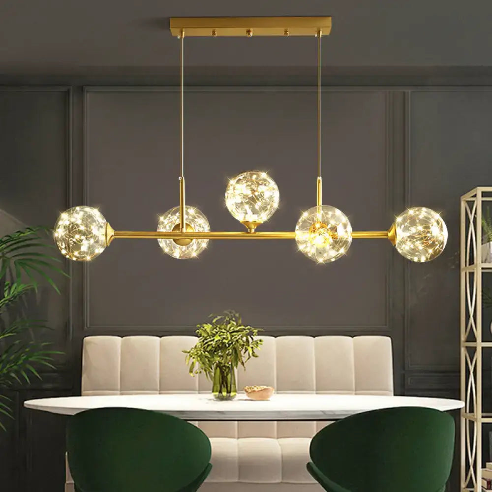 Minimalist brass led fairy light clear glass sphere dining room pendant