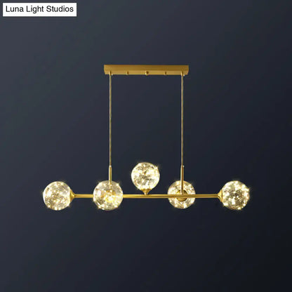 Minimalist brass led fairy light clear glass sphere dining room pendant