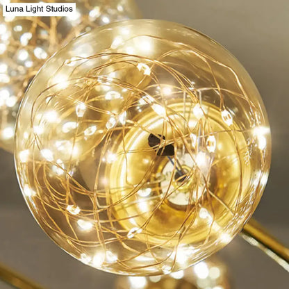 Minimalist brass led fairy light clear glass sphere dining room pendant