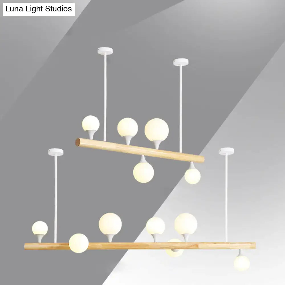 Modern wood linear hanging island light – kitchen opal glass globes