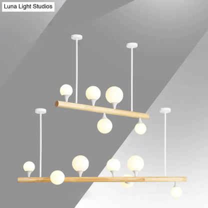 Modern wood linear hanging island light – kitchen opal glass globes