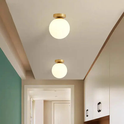 Modern brass ball ceiling light for living room with frosted glass
