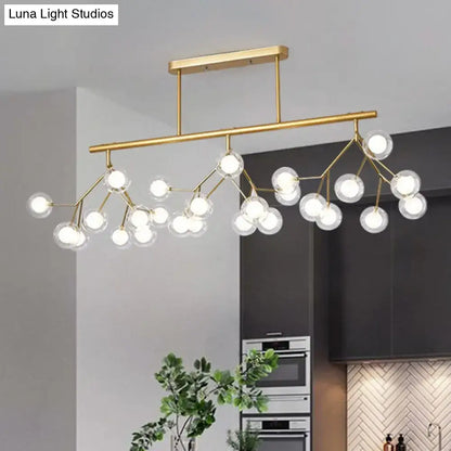 Modern gold firefly island pendant – dining room glass globe light