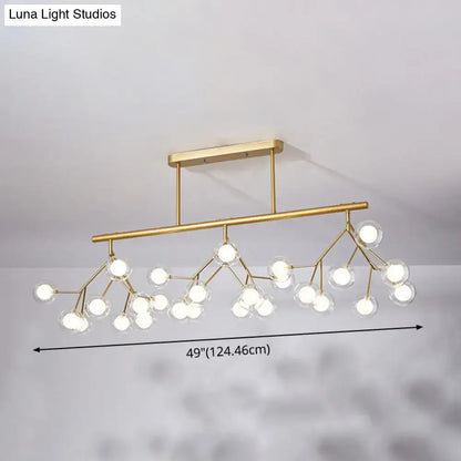 Modern gold firefly island pendant – dining room glass globe light