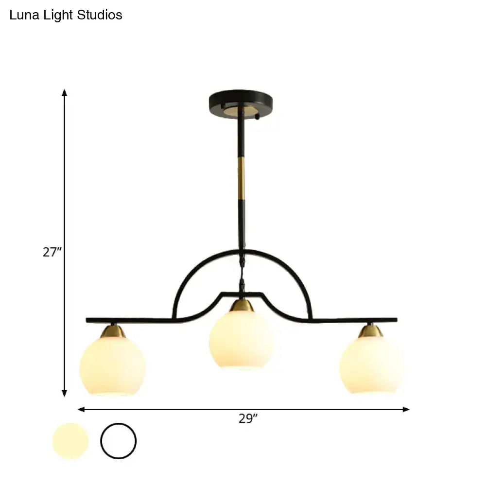Modern black & brass arched pendant light with clear white glass kitchen