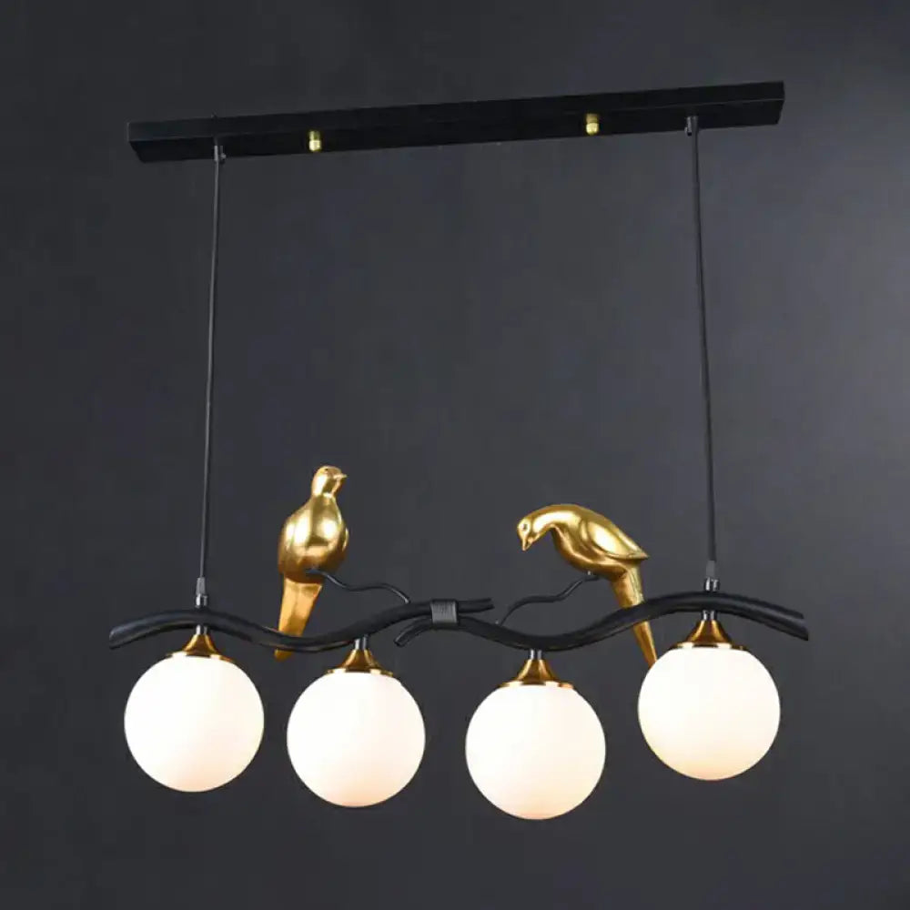 Modern bird branch island pendant light – dining room amber glass