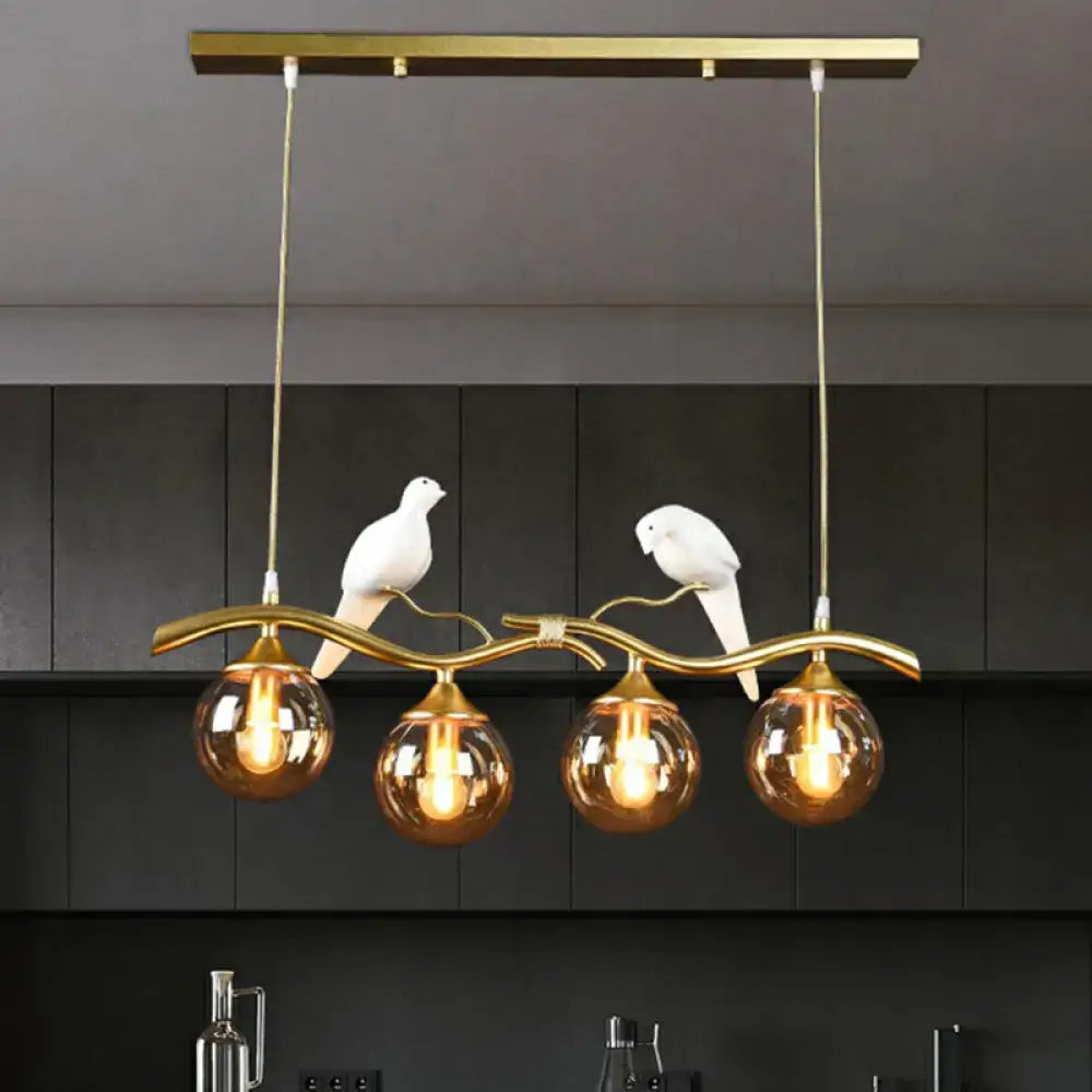 Modern bird branch island pendant light – dining room amber glass
